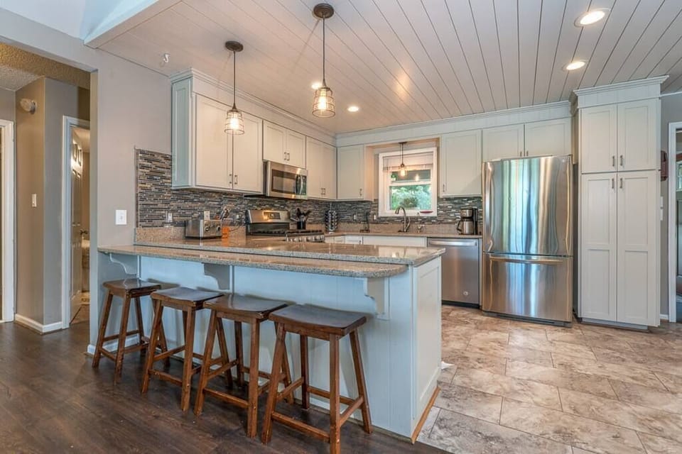 Fully Stocked Kitchen w/ Refrigerator, Stove, Oven, Microwave, Dishwasher, Cooking Utensils, and Breakfast Bar