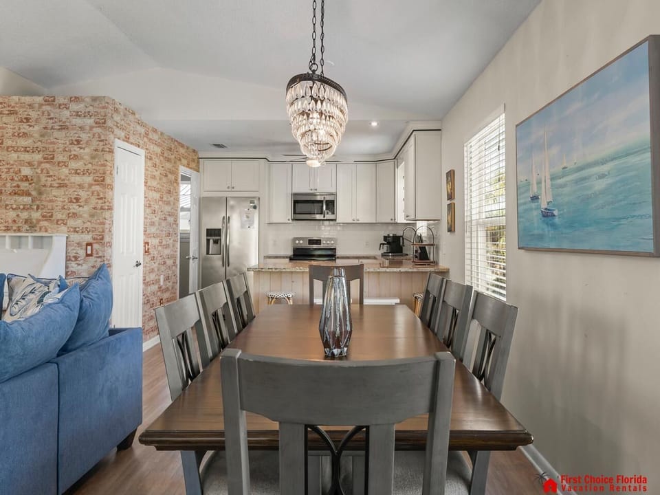 Spacious dining area with cozy living room and modern kitchen