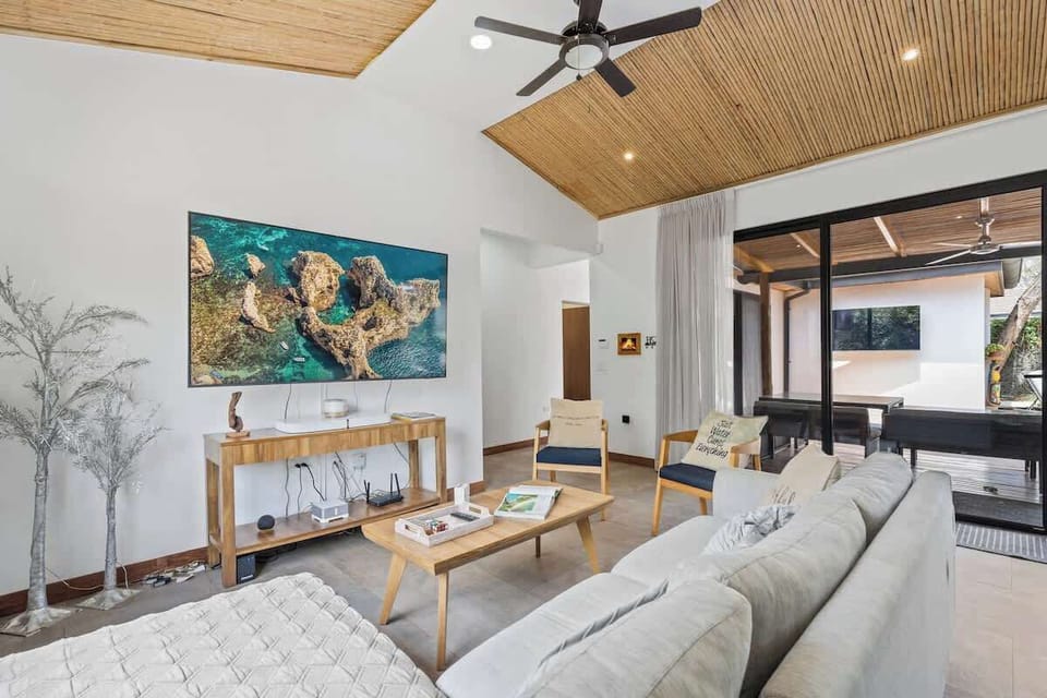 Living room with smart TV and comfortable seating
