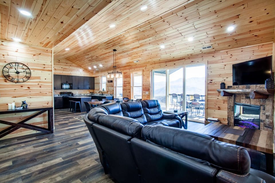 Spacious open-concept cabin with modern kitchen and mountain views.