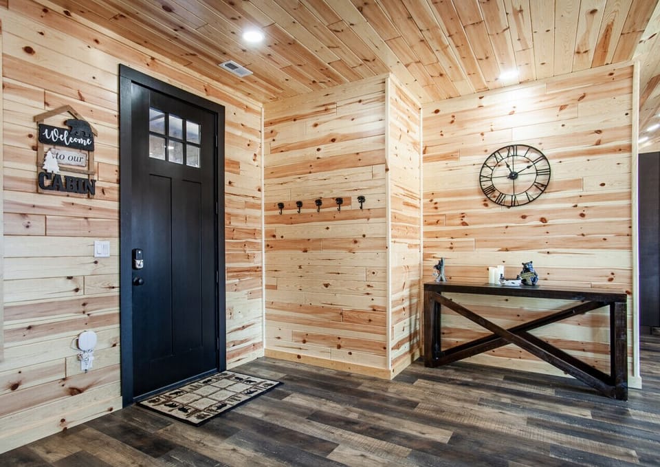 Inviting cabin entry with rustic charm and modern touches.