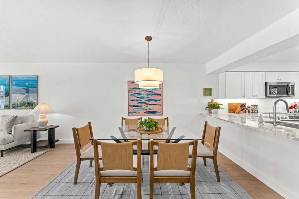 Dining area seamlessly flows into the living room and kitchen area for easy meals and connection.