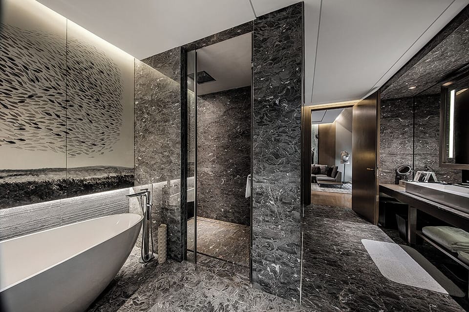 Junior Suite, 1 King Bed | Bathroom | Separate tub and shower, rainfall showerhead, designer toiletries
