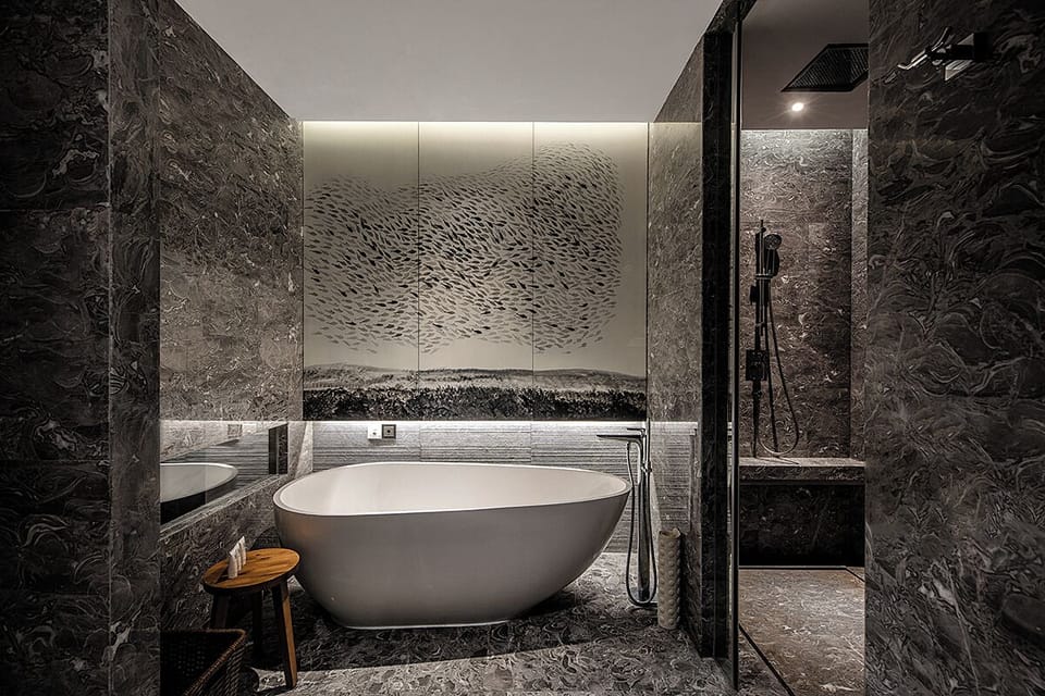 Junior Suite, 1 King Bed | Bathroom | Separate tub and shower, rainfall showerhead, designer toiletries