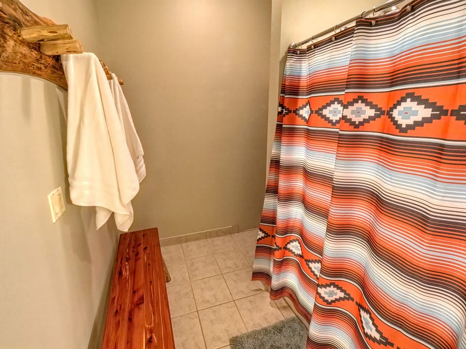 Shared large bathroom at another angle with shower
