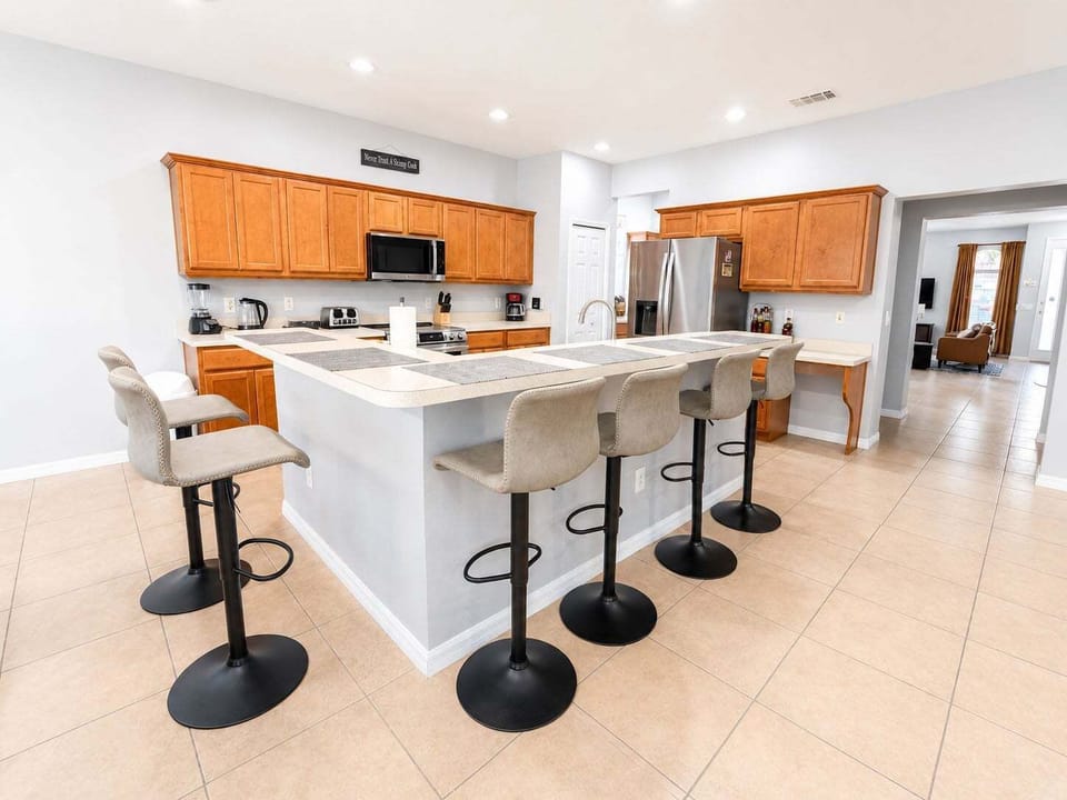 Kitchen showing breakfast bar seating