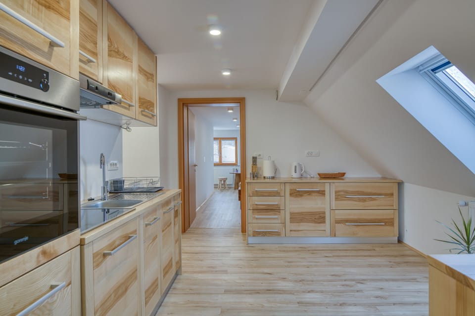 Kitchen to entrance to bedroom 2