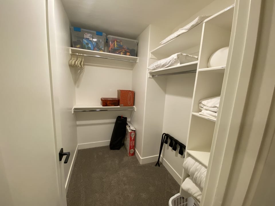 Bedroom #2 closet with a pack & play and toddler toys.