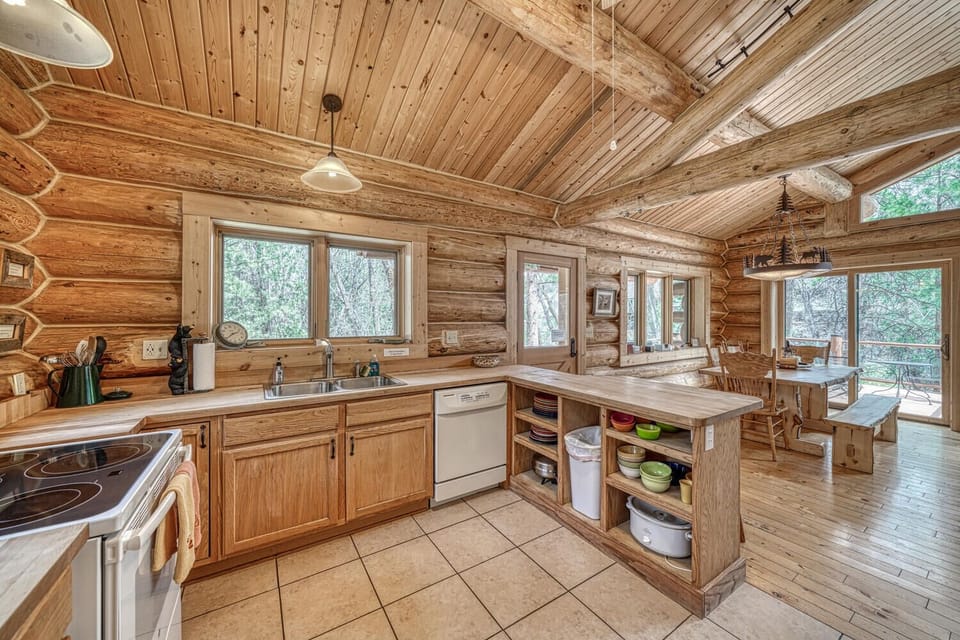 Fully-appointed kitchen with bar seating.