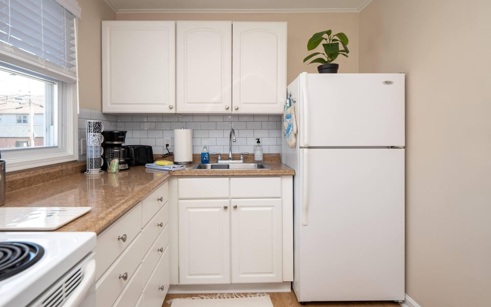 kitchen has stove, refrig., micro., toaster, coffee pot.