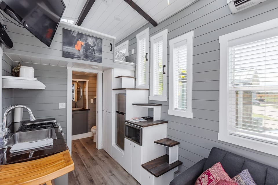 Kitchen fully equipped with a refrigerator, freezer, microwave, stove, oven and sink with hot/cold water. Enjoy coffee from the coffee maker and ample counter space. Essentials include cookware, dishes, utensils, and plenty of storage cabinets.