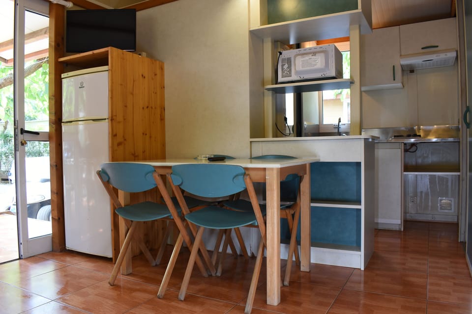 Comfort Bungalow | Living area | 24-inch TV with digital channels, table tennis