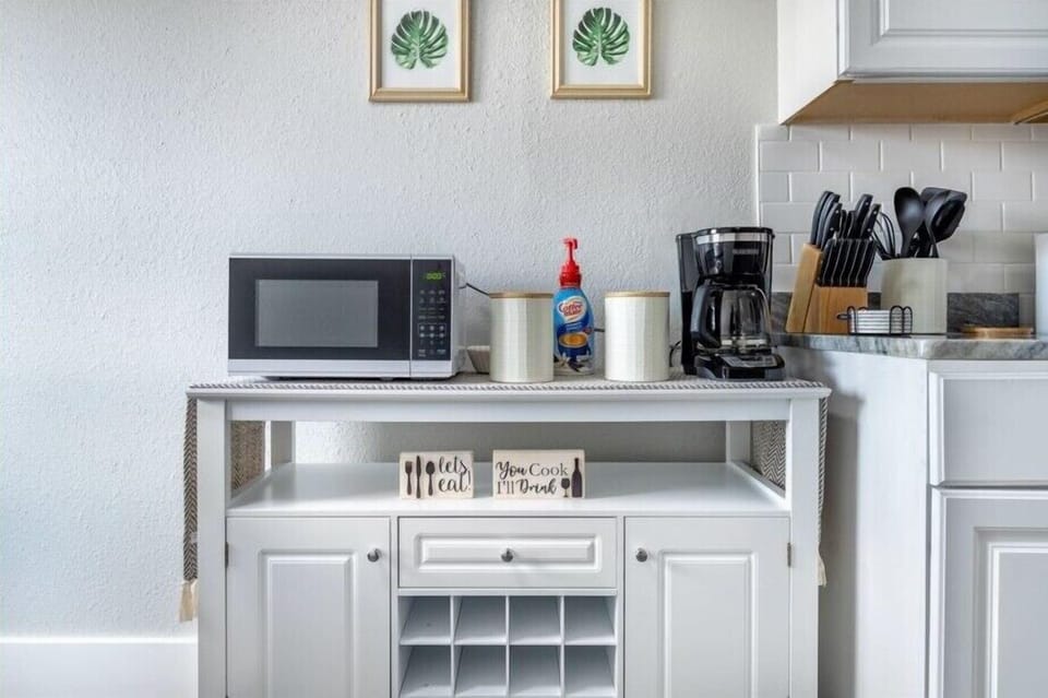Discover the joy of cooking in a kitchen that blends modern design with classic charm.