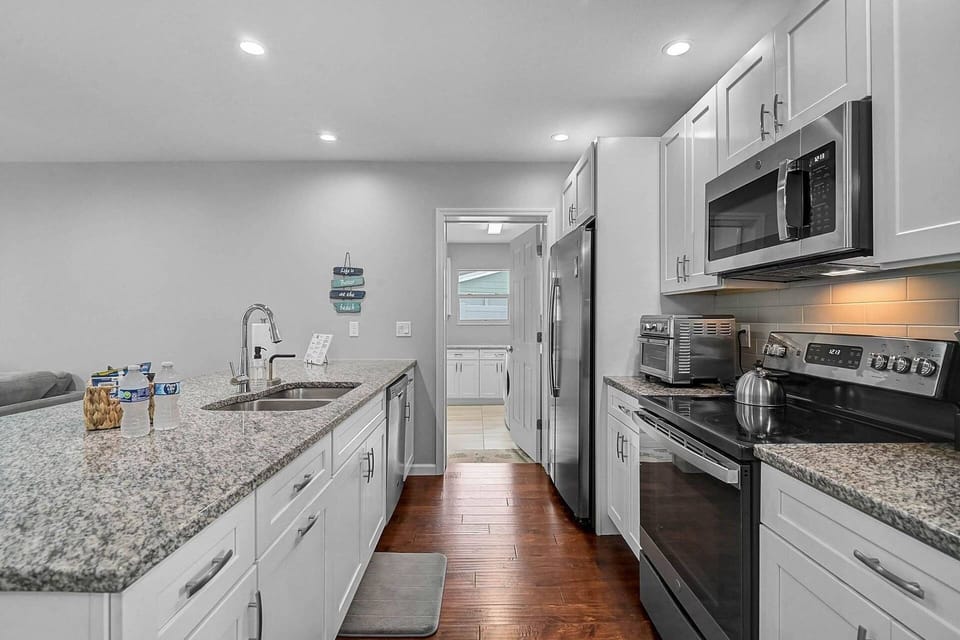 Kitchen leads to a large laundry room for your convenience