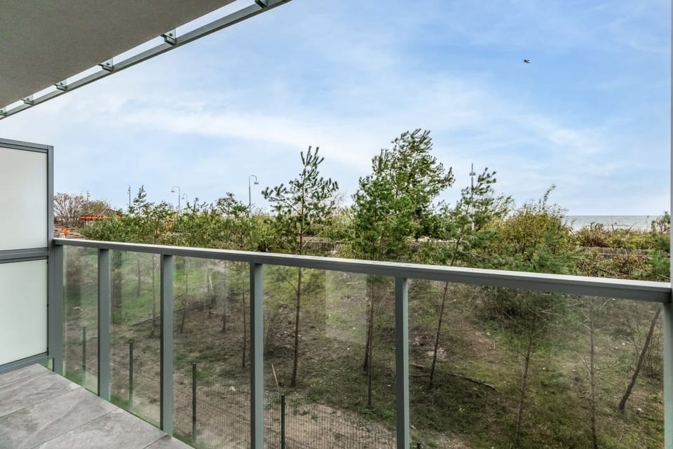 A balcony with a beautiful forest view, ideal for relaxation and fresh air.

