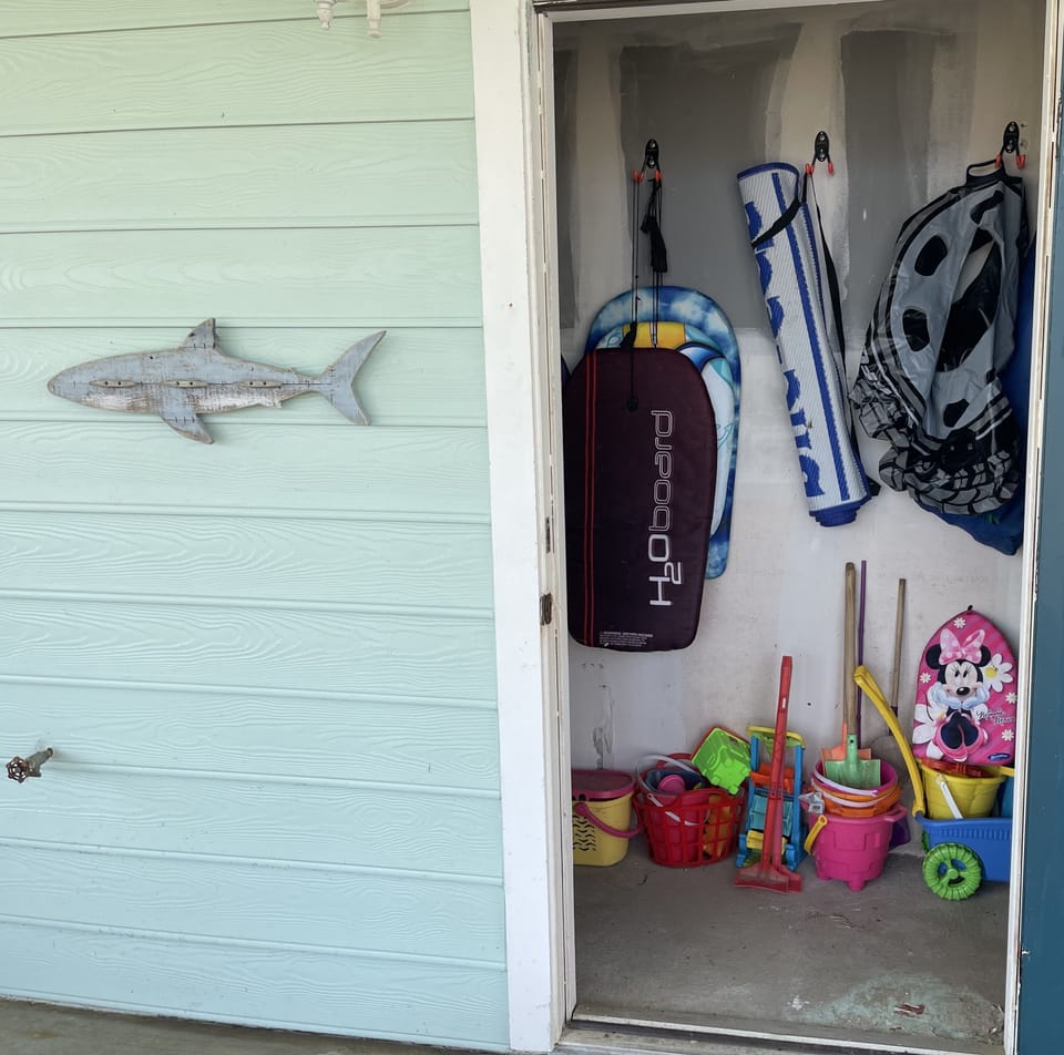 Beach chairs, boogie boards, and toys are provided. 