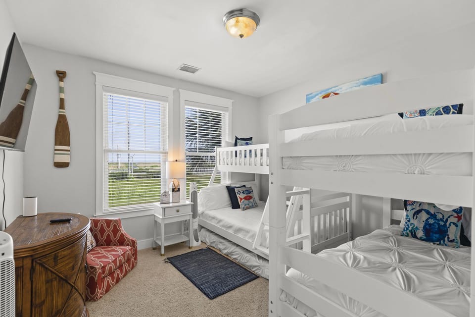 Bunk bedroom offers a twin over full bunk bed and a twin over twin bunk bed. 