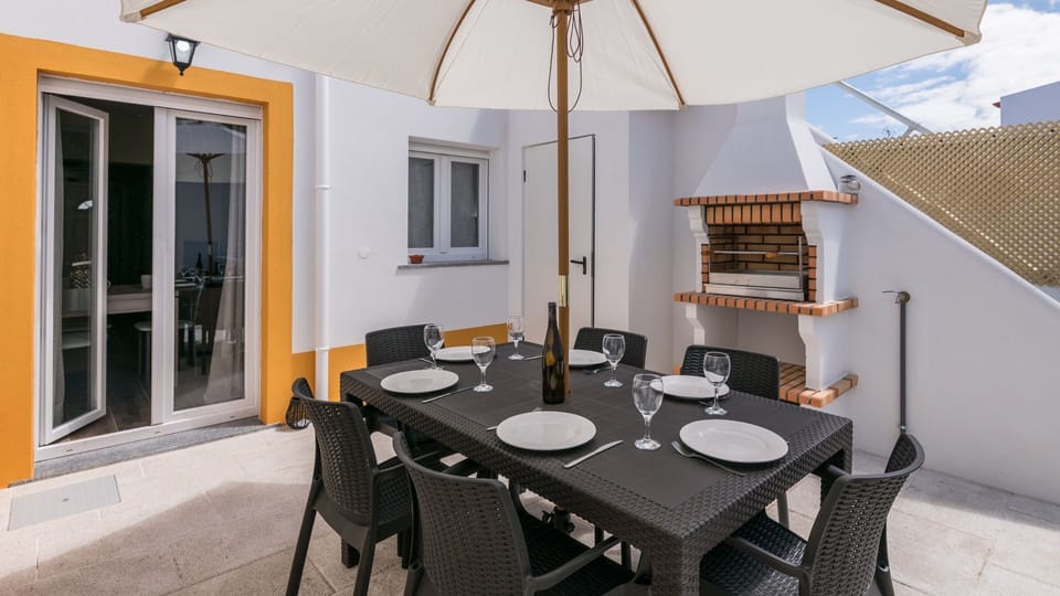 Savor delightful al fresco dining on your private terrace, shaded by a large umbrella and featuring a built-in barbecue for memorable gatherings.
#PrivateTerrace #OutdoorDining #LovelyStay