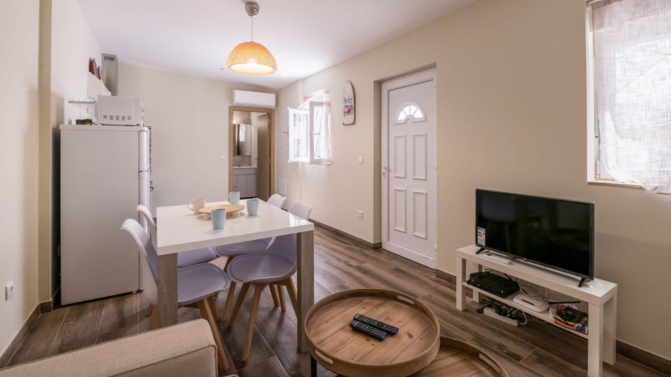 The living area comes with all you could require during your stay, including an AC!