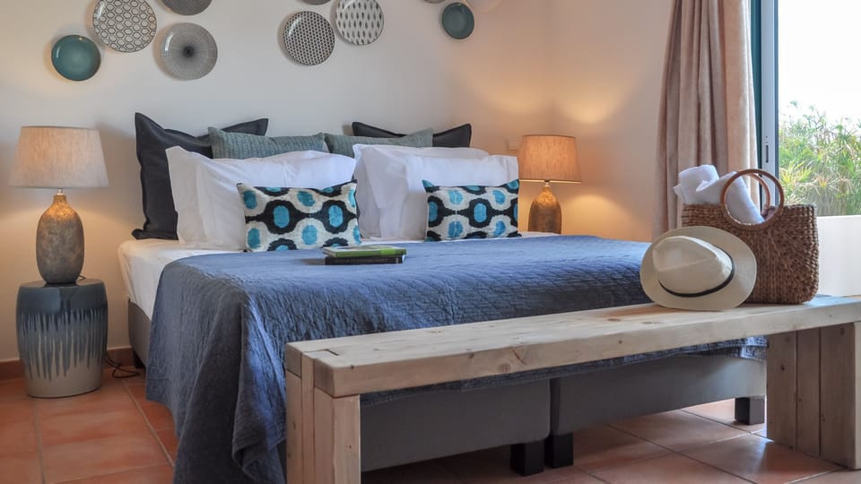Drift into peaceful slumber in this serene bedroom, designed for ultimate comfort and relaxation after a day of exploration.
#Bedroom #ComfortableBed #LovelyStay