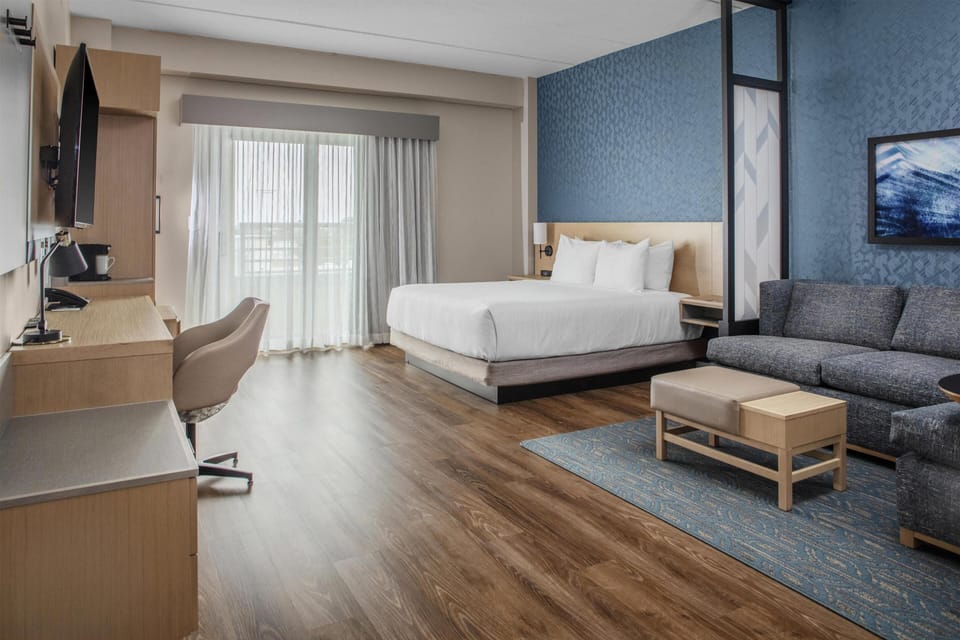 Room, 1 King Bed with Sofa bed, Balcony | In-room safe, blackout drapes, free WiFi, bed sheets
