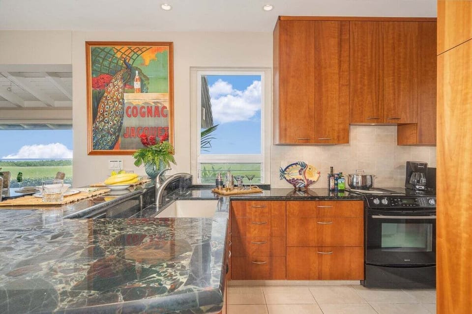 Enjoy a bright kitchen with warm wood tones and panoramic outdoor scenery.
