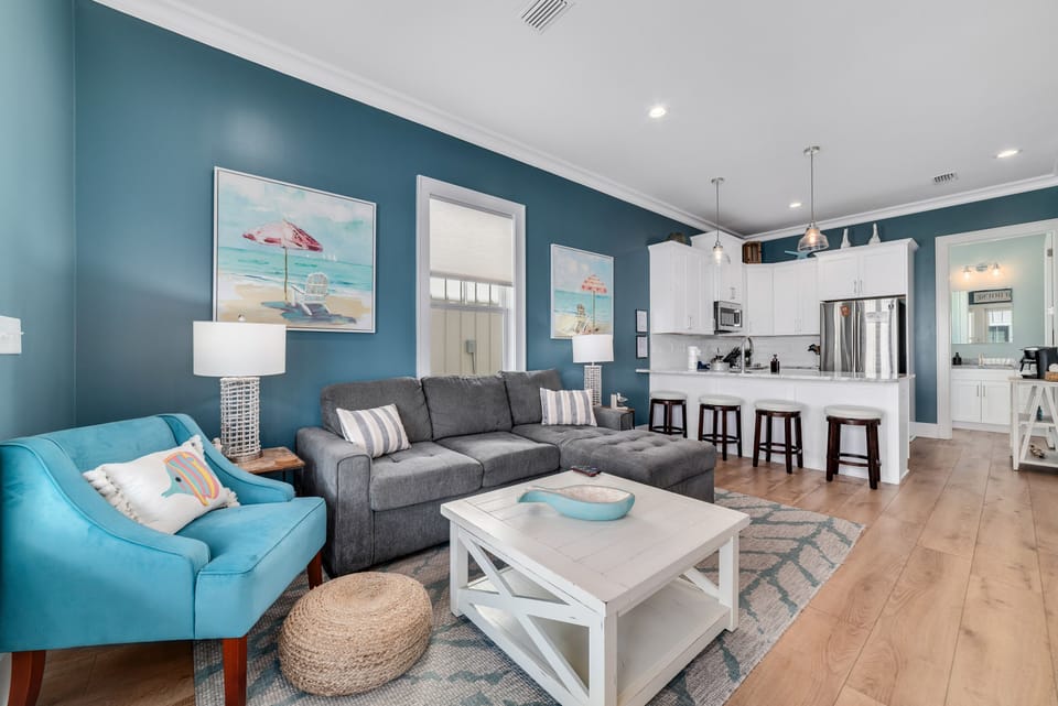 Open living room, dining room and kitchen areas.