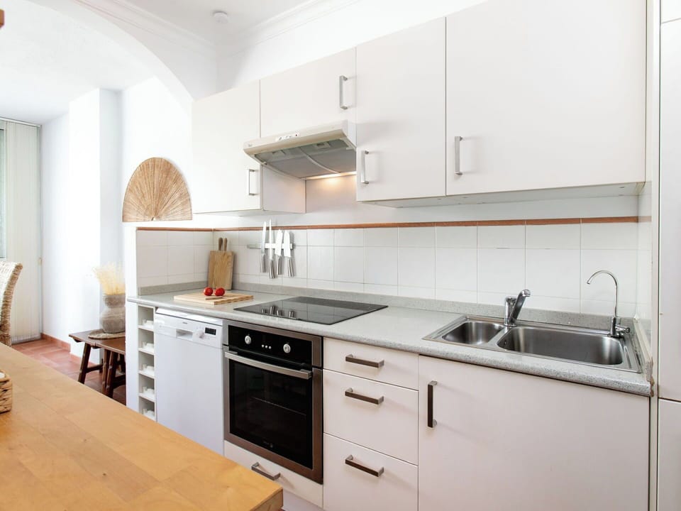 Kitchen, Kitchen Appliance, Countertop, Cabinetry, Furniture, Major Appliance, Flooring, Interior Design, Wood, Home Appliance