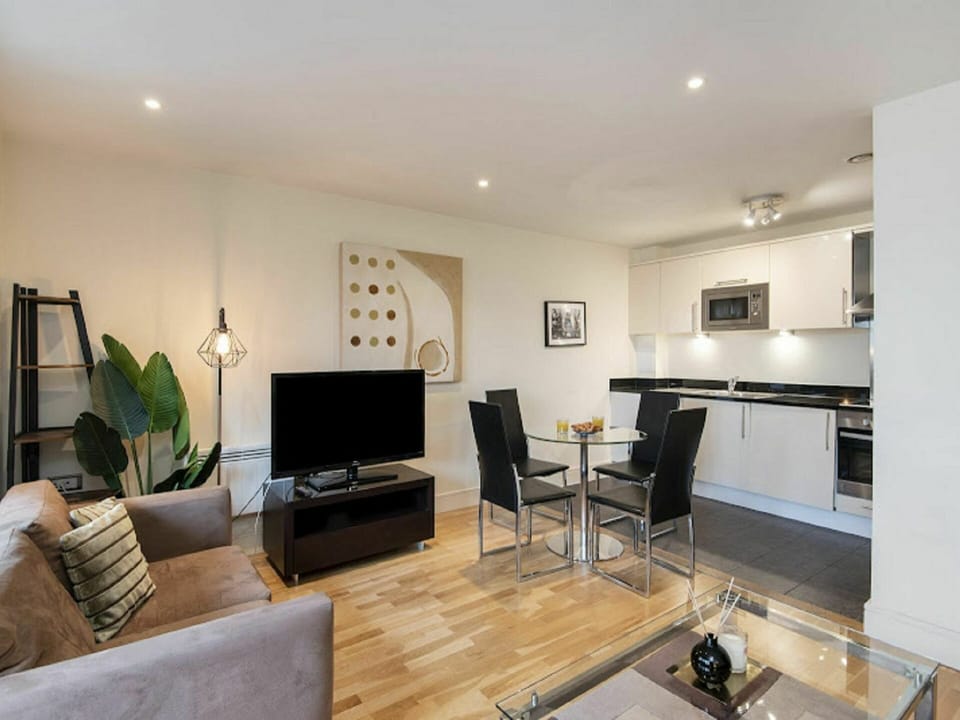 Couch, Property, Furniture, Table, Wood, Building, Living Room, Flooring, Television, Interior Design