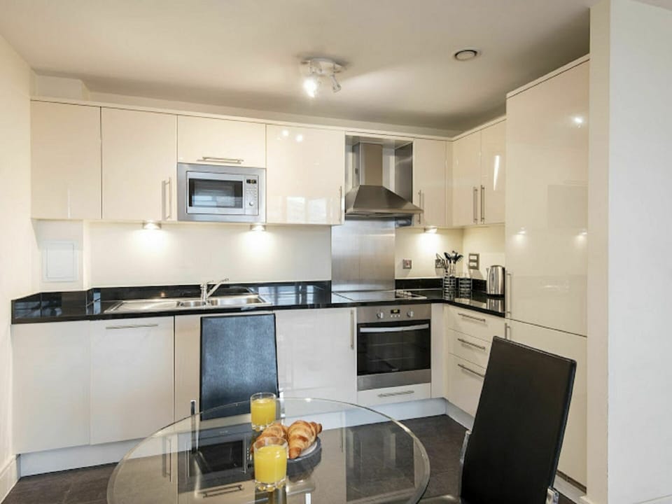 Cabinetry, Countertop, Kitchen Appliance, Kitchen Stove, Kitchen, Sink, Tap, Kitchen Sink, Building, Lighting