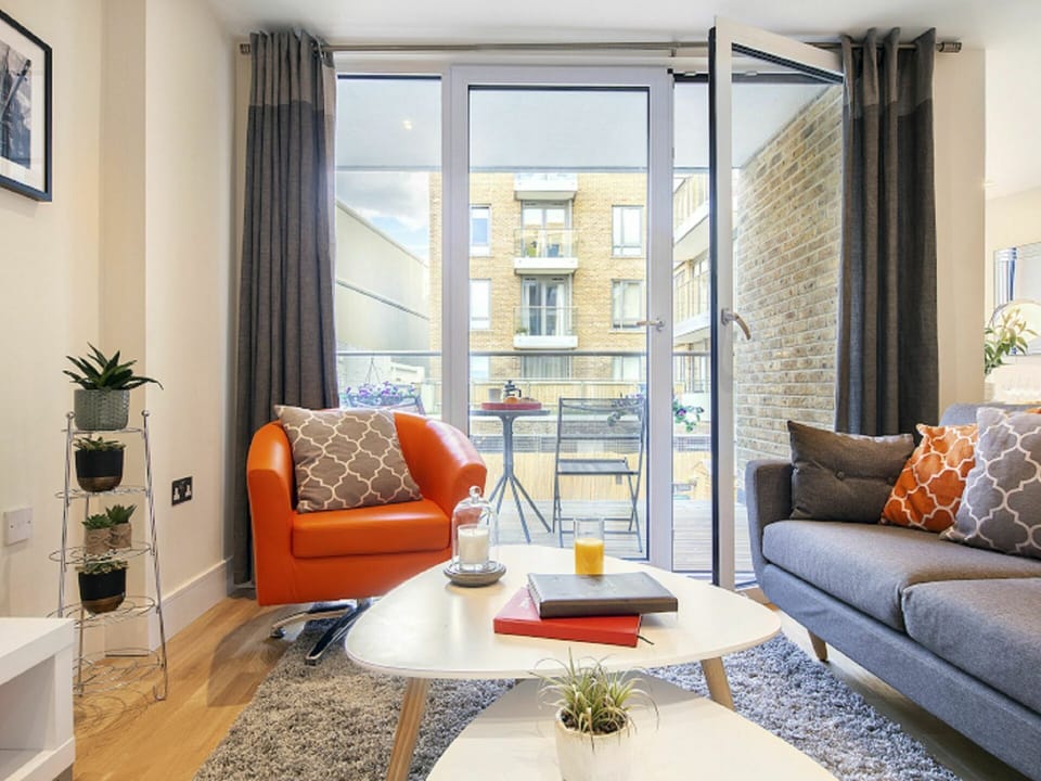 Furniture, Table, Property, Couch, Plant, Comfort, Picture Frame, Window, Orange, Interior Design