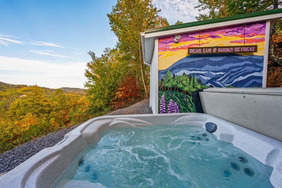 Private outdoor hot tub with gorgeous mountain view and Smoky Mountain mural. 