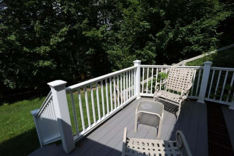 Back Patio Next to Snow Brook and Easy walking path to Town Square from Condo In Waterville Valley
