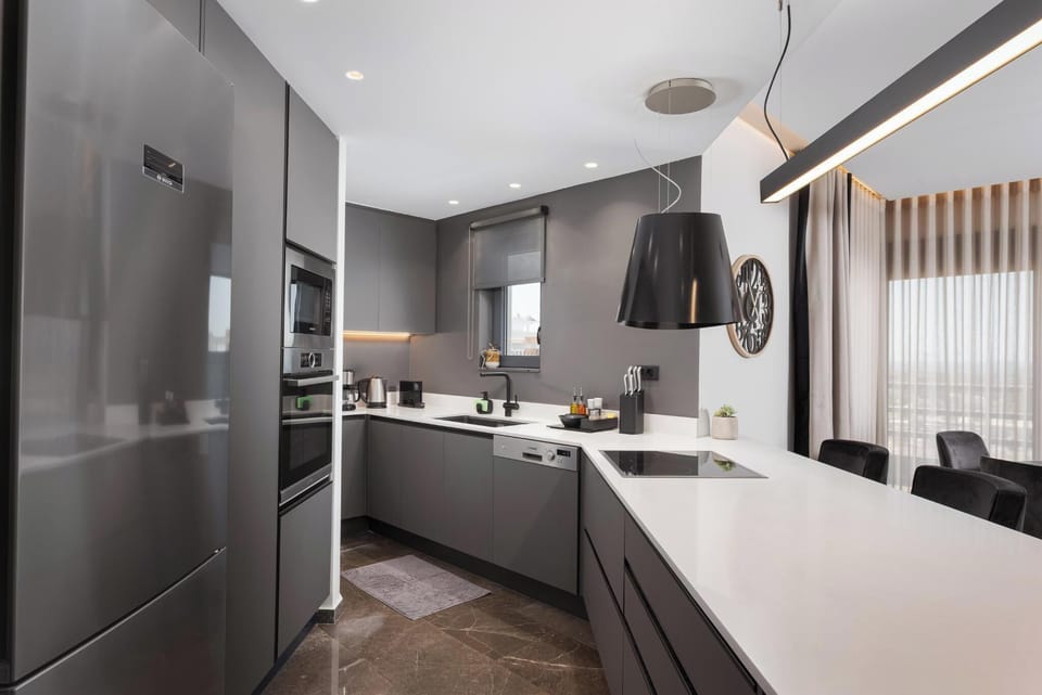Deluxe Apartment, 2 Bedrooms, Sea View | Private kitchen | Full-size fridge, microwave, oven, stovetop