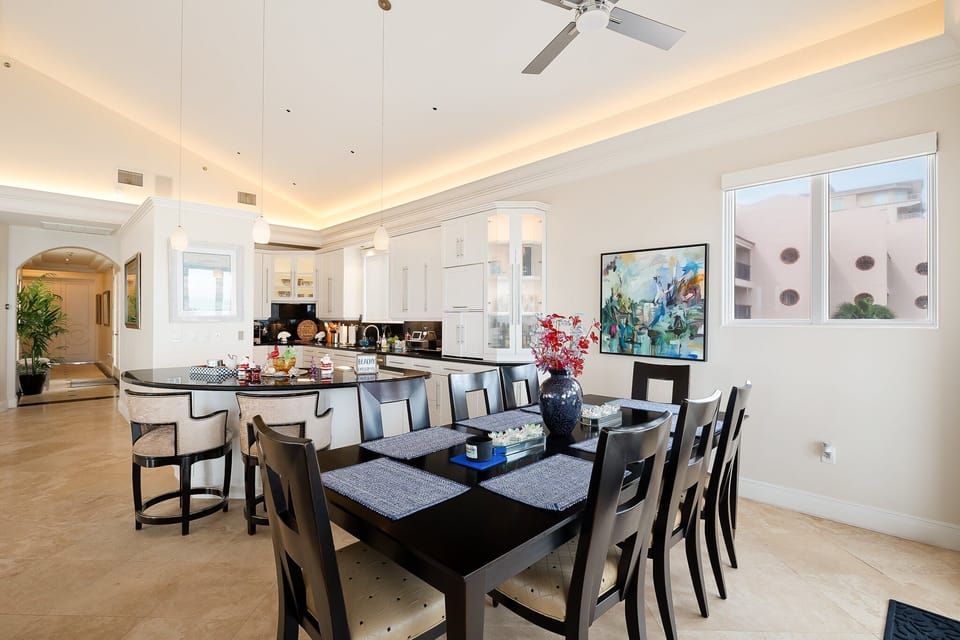 Dining area has seating for 8, with 2 additional seats at the bar.