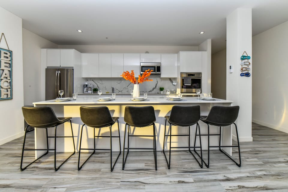Cook with ease in our Noord Aruba 2BR condo's fully equipped kitchen - featuring all essential accessories, abundant storage, spacious work areas, a bright atmosphere, and available high chairs.