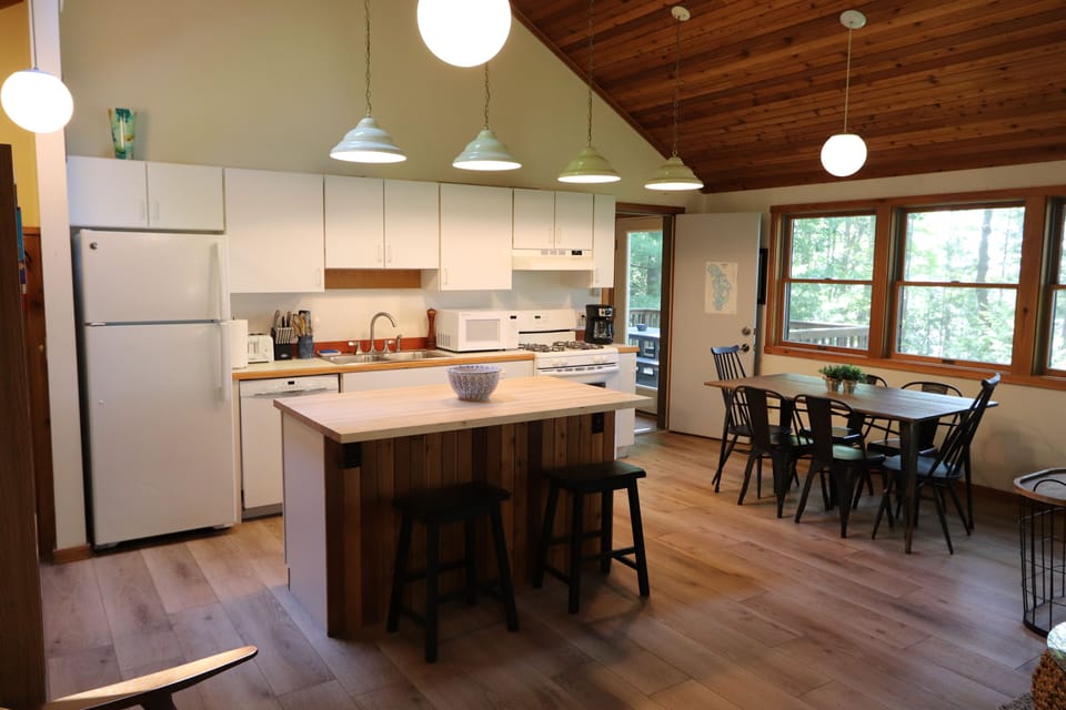 The kitchen is well-stocked and has a dishwasher.