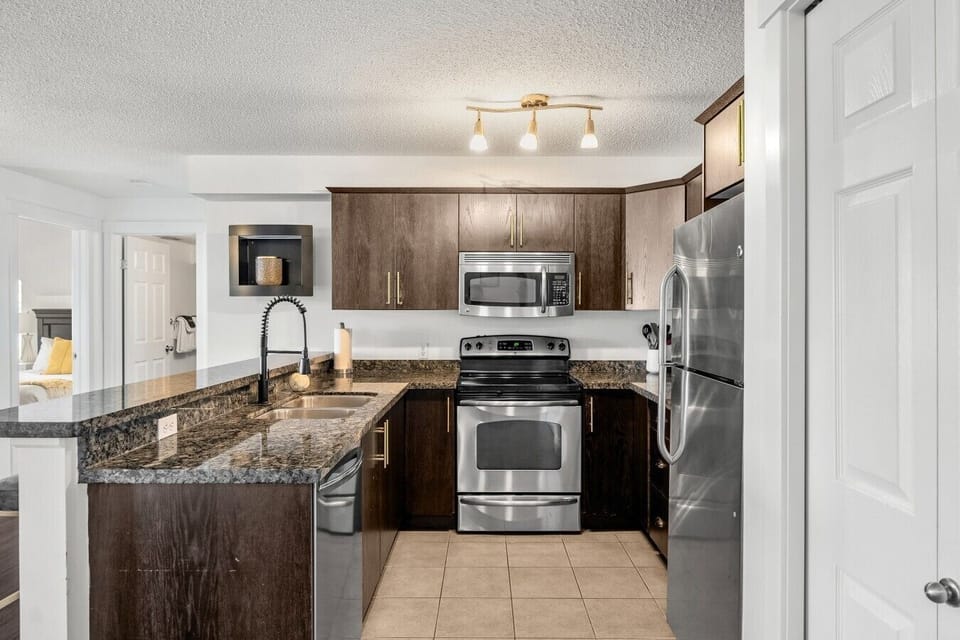 Full kitchen with a blender, drip coffee machine, ground coffee, tea, sugar and basic condiments (ketchup, mustard and relish.)