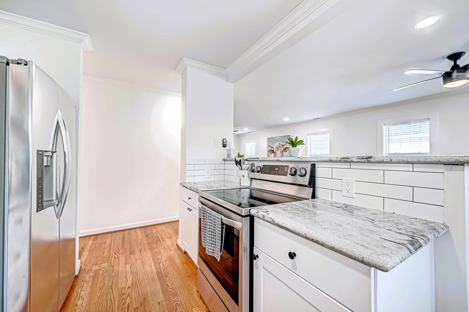 Full kitchen and new electric stove with oven and 4 burners.