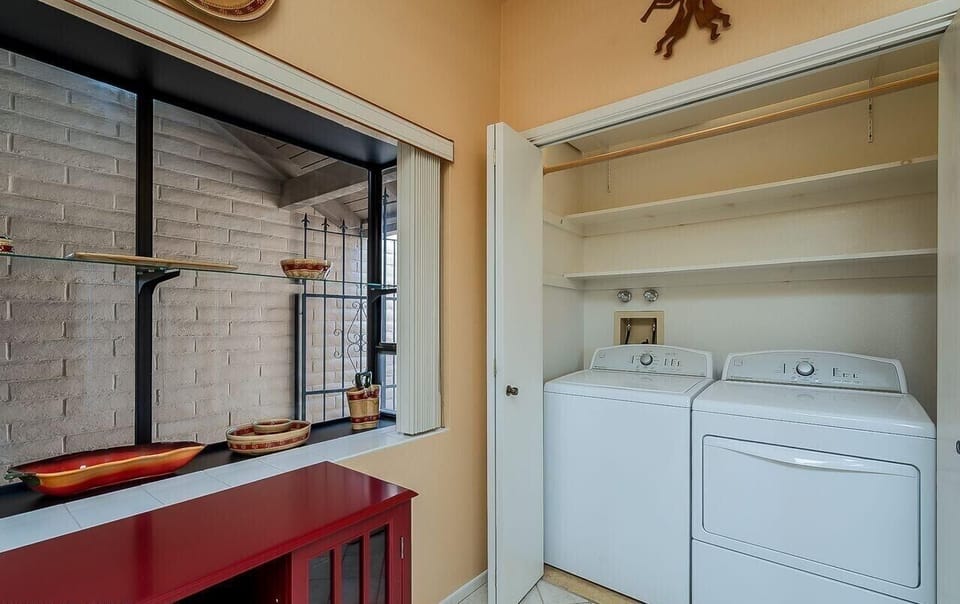 Kitchen with washer and dryer in closet
