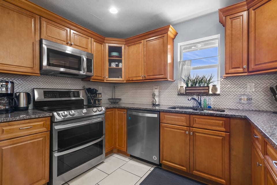 Our home is equipped with top-of-the-line kitchen amenities! Enjoy the pleasure of preparing your hearty meal in our kitchen which provides everything you need to unleash your inner chef. 