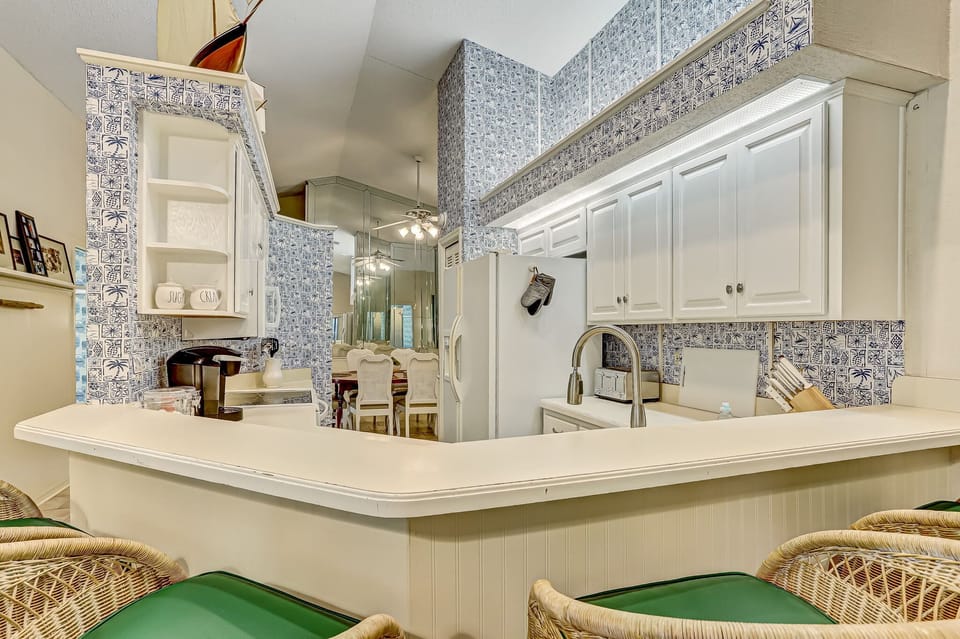 Fully Equipped Kitchen with Bar Stool Seating for Three