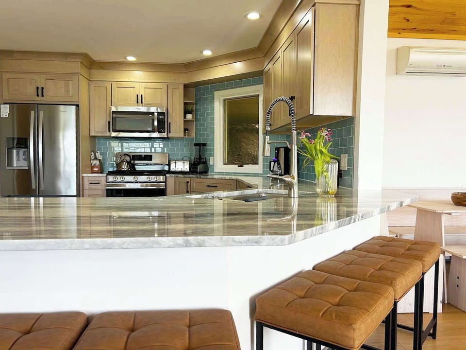 Everything you need to cook and gather, from high-end appliances to spacious island seating.