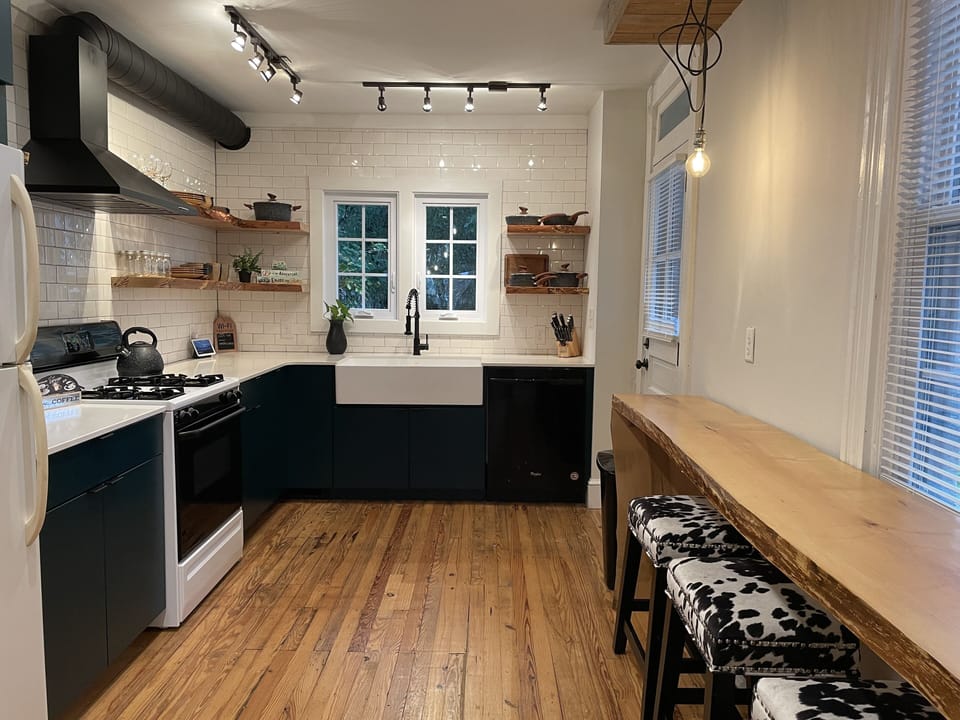 Full kitchen with toaster oven, microwave, blender, coffee machine
