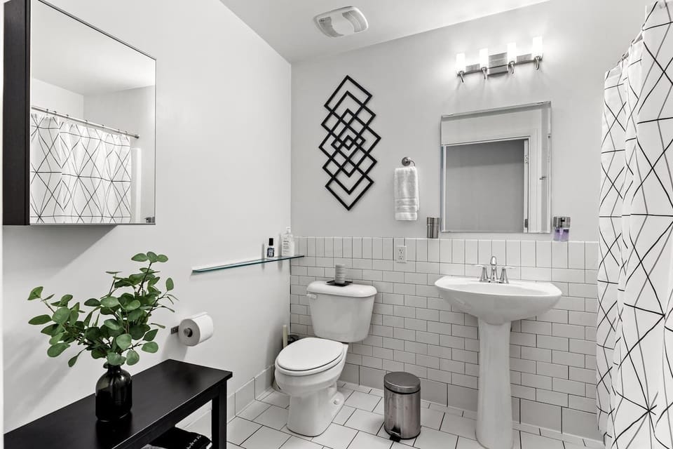 Full bathroom w/ tub & shower combo. 