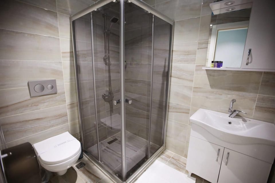 Hydromassage showerhead, designer toiletries, hair dryer, bathrobes