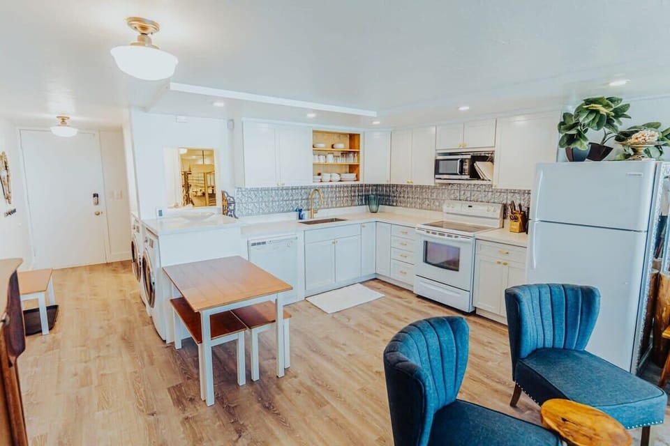 Full kitchen with dishwasher, oven, range, microwave, all the cookware and amenities!