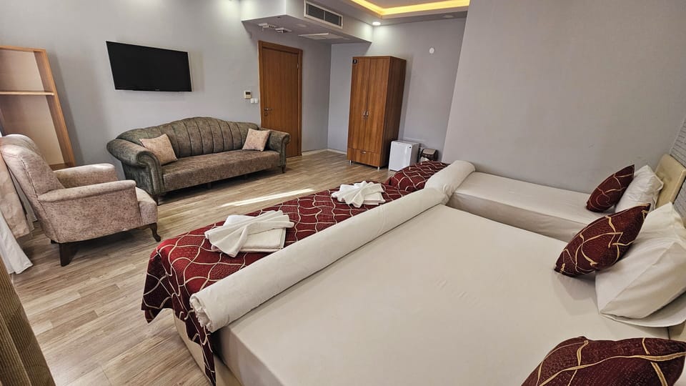 Deluxe Triple Room | Premium bedding, minibar, in-room safe, individually decorated