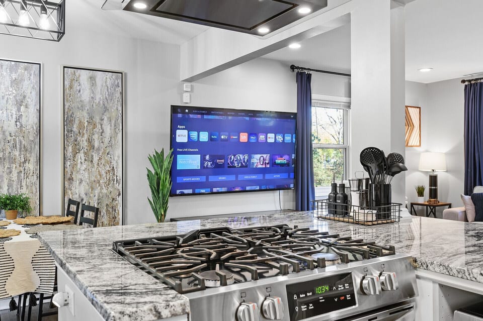 Gas stove top and 70" TV to living room. 