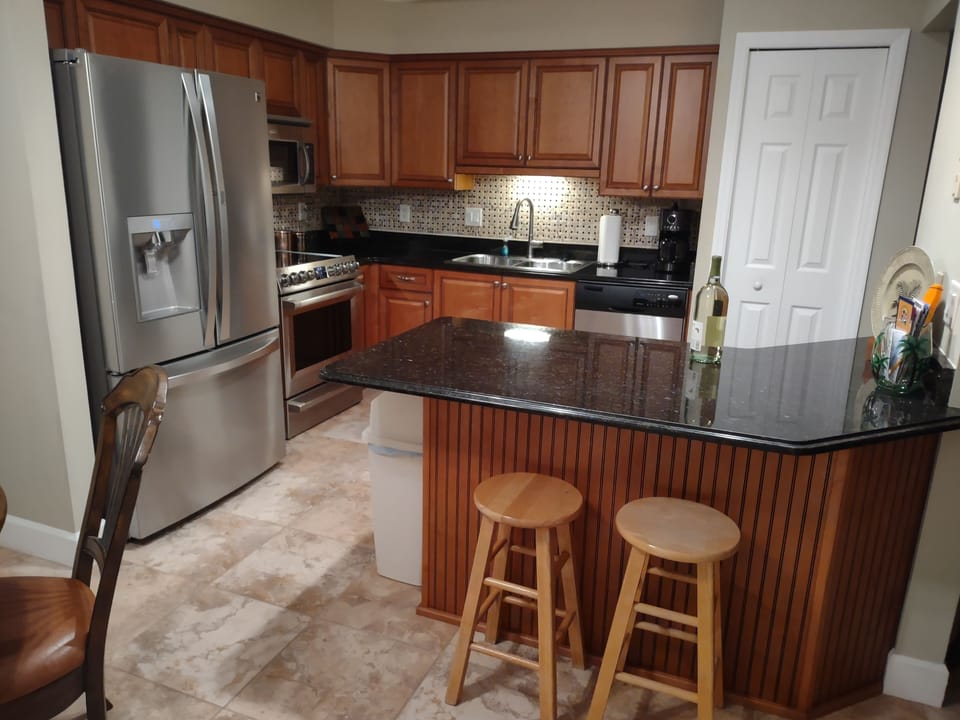 Kitchen and breakfast bar.  Brand new stove and refrigerator 